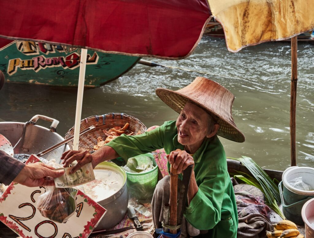 An Old Lady selling in Floating Market Bangkok